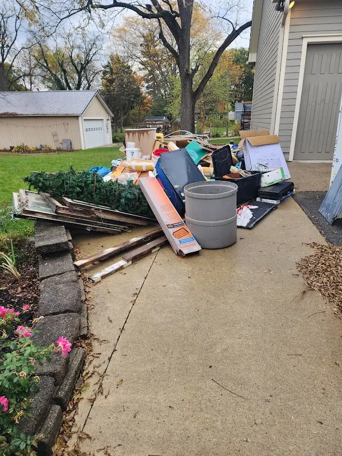 Dumpster being loaded with debris for Roofing Dumpster Rental in Kiryas Joel